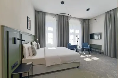 Łóżko lub łóżka w pokoju w obiekcie Herbal Hotel Wrocław