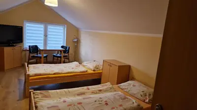 Łóżko lub łóżka w pokoju w obiekcie Agroturystyka Nad Cichą
