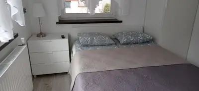 Łóżko lub łóżka w pokoju w obiekcie Wypoczynek Pod Lasem