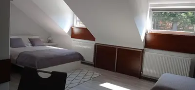Łóżko lub łóżka w pokoju w obiekcie Wypoczynek Pod Lasem