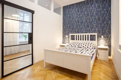 Łóżko lub łóżka w pokoju w obiekcie Victoria Apartment
