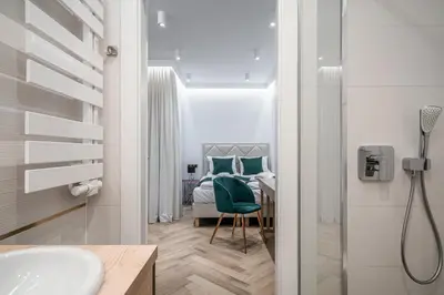 Łóżko lub łóżka w pokoju w obiekcie RentPlanet - Apartamenty Jagiełły
