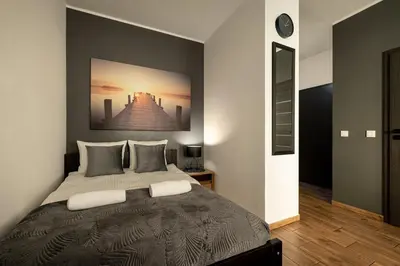 Łóżko lub łóżka w pokoju w obiekcie RentPlanet - Apartamenty Jagiełły