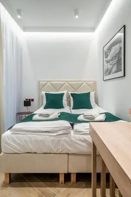 Łóżko lub łóżka w pokoju w obiekcie RentPlanet - Apartamenty Jagiełły