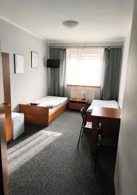 Łóżko lub łóżka w pokoju w obiekcie Moravia