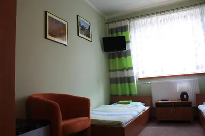 Łóżko lub łóżka w pokoju w obiekcie Moravia