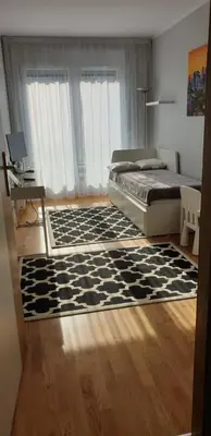 Łóżko lub łóżka w pokoju w obiekcie River Deluxe Atal Towers Apartment