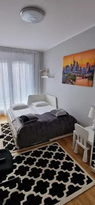 Łóżko lub łóżka w pokoju w obiekcie River Deluxe Atal Towers Apartment