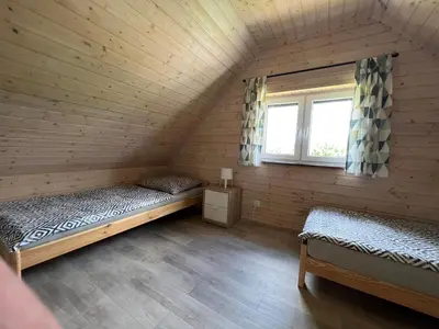 Łóżko lub łóżka w pokoju w obiekcie Bliżej Ślęży Domki pod Ślężą