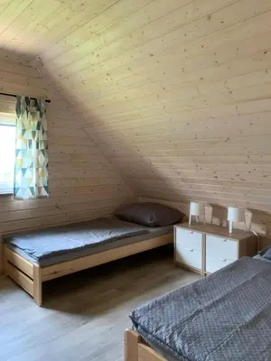 Łóżko lub łóżka w pokoju w obiekcie Bliżej Ślęży Domki pod Ślężą