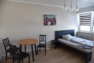 Łóżko lub łóżka w pokoju w obiekcie Kawalerka Górnośląska