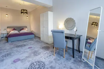 Łóżko lub łóżka w pokoju w obiekcie Hotel Mikulski