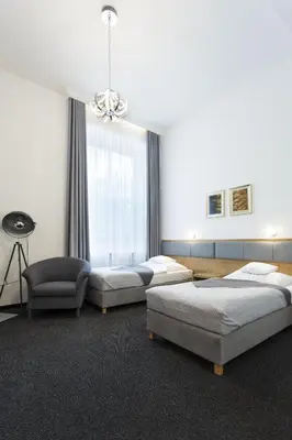 Łóżko lub łóżka w pokoju w obiekcie InterHotel