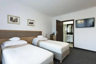 Łóżko lub łóżka w pokoju w obiekcie InterHotel