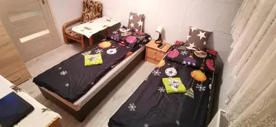 Łóżko lub łóżka w pokoju w obiekcie APARTAMENT MILKA w Dusznikach Zdroju
