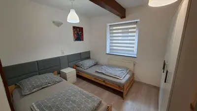 Łóżko lub łóżka w pokoju w obiekcie Agroturystyka Romanówka w Krzeszowie