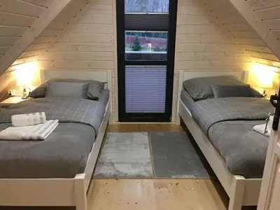 Łóżko lub łóżka w pokoju w obiekcie Bajkowe Domki