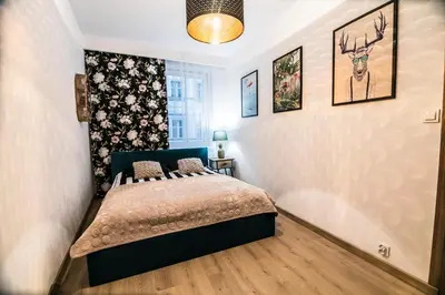 Łóżko lub łóżka w pokoju w obiekcie AP Apartment's W Rynku