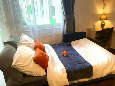 Łóżko lub łóżka w pokoju w obiekcie Modern Calm Studio, Wroclaw
