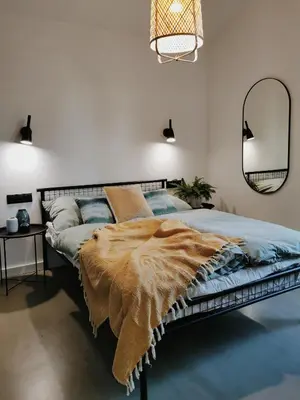 Łóżko lub łóżka w pokoju w obiekcie Domki MODERN Jezioro Nyskie