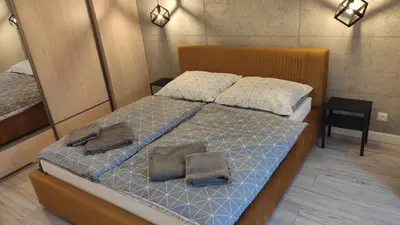 Łóżko lub łóżka w pokoju w obiekcie Apart Hotel 38 (95m2)