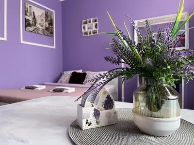 Łóżko lub łóżka w pokoju w obiekcie Apartament Lawendowy