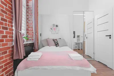 Łóżko lub łóżka w pokoju w obiekcie Princess Dream apartment in the heart of Wroclaw