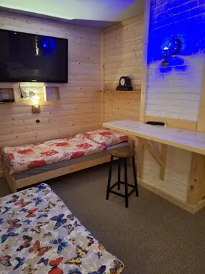 Łóżko lub łóżka w pokoju w obiekcie Magnoliowy Zakątek