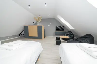 Łóżko lub łóżka w pokoju w obiekcie Koliberek Apartamenty