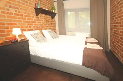 Łóżko lub łóżka w pokoju w obiekcie Centrum Turystyki Niekonwencjonalnej