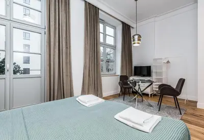 Łóżko lub łóżka w pokoju w obiekcie Rent like home - Księcia Józefa Poniatowskiego 2