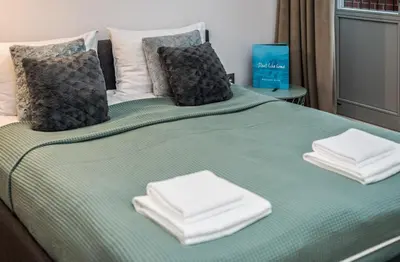 Łóżko lub łóżka w pokoju w obiekcie Rent like home - Księcia Józefa Poniatowskiego 2
