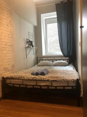 Łóżko lub łóżka w pokoju w obiekcie Dmowskiego blisko Rynku