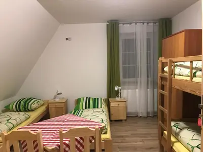 Łóżko lub łóżka w pokoju w obiekcie Hostel Polskie Wrota