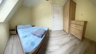Łóżko lub łóżka w pokoju w obiekcie Nad Strumykiem max