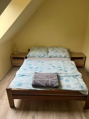 Łóżko lub łóżka w pokoju w obiekcie Nad Strumykiem max