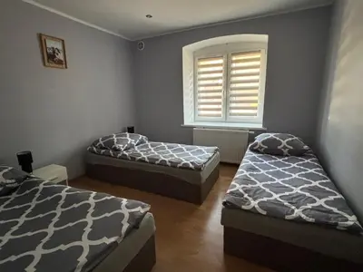 Łóżko lub łóżka w pokoju w obiekcie Apartament u Wojtusia