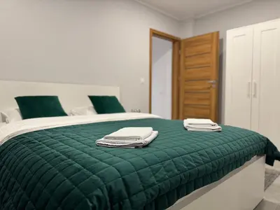 Łóżko lub łóżka w pokoju w obiekcie Sudety Resort Apartament Park Zdrojowy