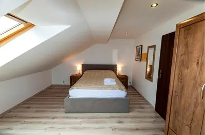 Łóżko lub łóżka w pokoju w obiekcie Apartamenty Sowiogórskie