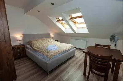 Łóżko lub łóżka w pokoju w obiekcie Apartamenty Sowiogórskie