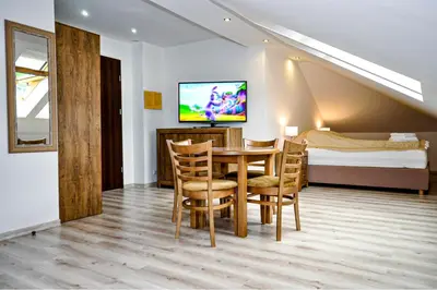 Telewizja i/lub zestaw kina domowego w obiekcie Apartamenty Sowiogórskie