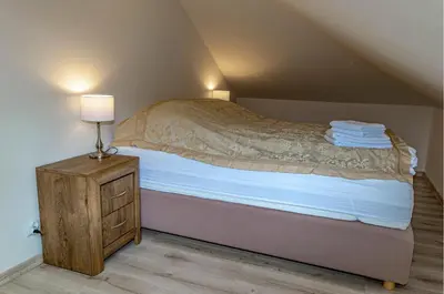 Łóżko lub łóżka w pokoju w obiekcie Apartamenty Sowiogórskie