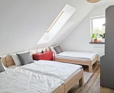 Łóżko lub łóżka w pokoju w obiekcie Apartament Wrzosowa 25