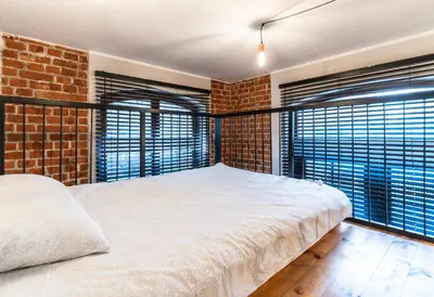 Łóżko lub łóżka w pokoju w obiekcie Apartamenty loftowe blisko Rynku