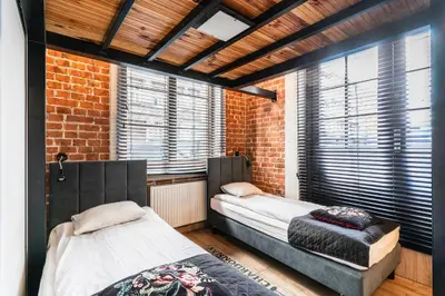 Łóżko lub łóżka w pokoju w obiekcie Apartamenty loftowe blisko Rynku