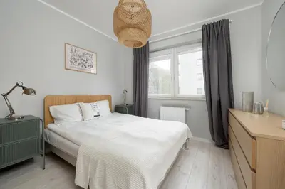 Łóżko lub łóżka w pokoju w obiekcie Promenady Green Apartments by Noclegi Renters