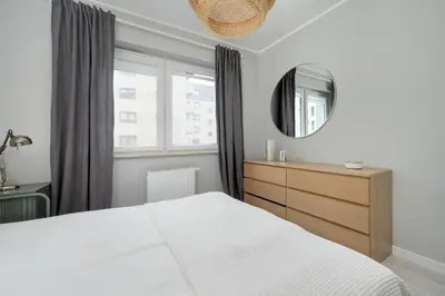 Łóżko lub łóżka w pokoju w obiekcie Promenady Green Apartments by Noclegi Renters