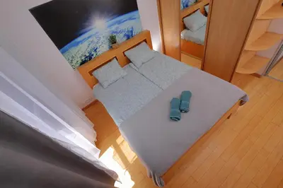 Łóżko lub łóżka w pokoju w obiekcie Apartament Słoneczny 5