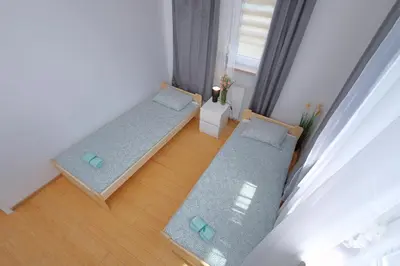 Łóżko lub łóżka w pokoju w obiekcie Apartament Słoneczny 5
