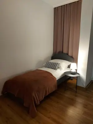 Łóżko lub łóżka w pokoju w obiekcie Apartamenty Lawendowy Zakątek 5